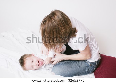 Mother and son tickle time