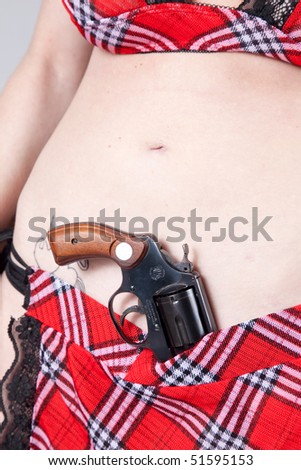 woman with a pistol in her belt