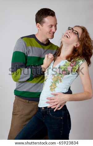 Romantic couple laughing together in relationship