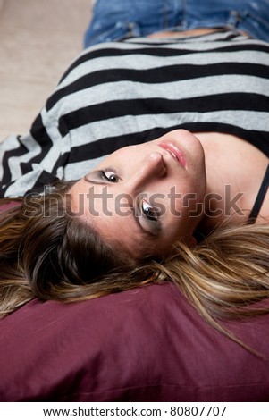 Lovely woman laying down with eye contact