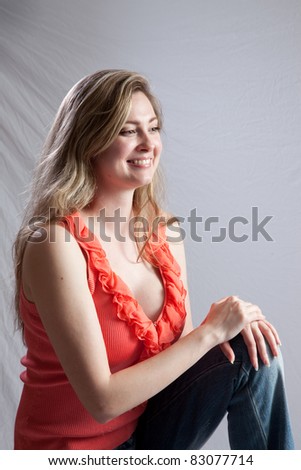 Lovely white woman sitting and looking to the right