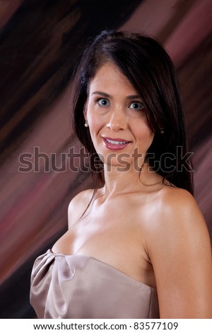 Beautiful woman with bare shoulders smiling with a friendly smile