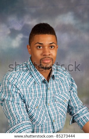 Handsome black man with serious expression and eye contact