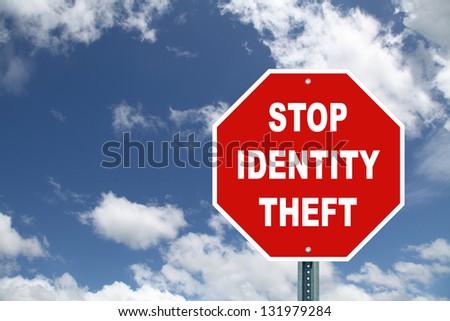 Stop Identity theft red stop sign against cloudy sky