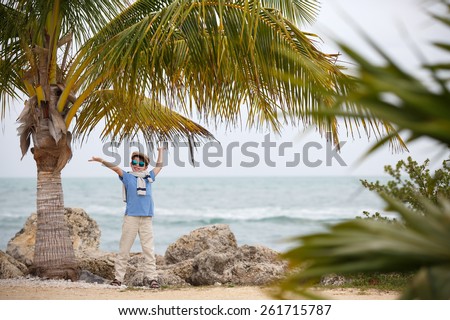 Cheerful little boy having relax outdoors during his summer vacation