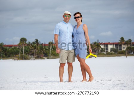 Young couple at tropical beach during summer vacation, Siesta Key beach, Florida