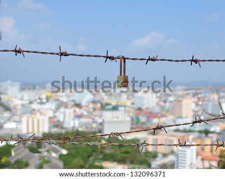view of city through wire fence