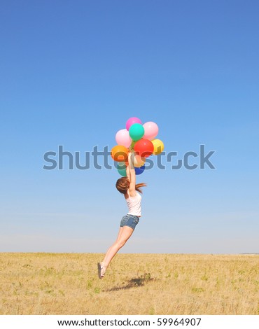 young jumping woman with balloons