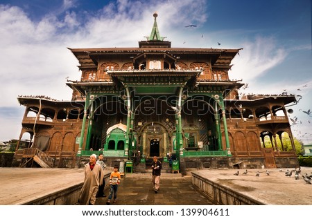 SRINAGAR, INDIA - APRIL 11: Muslim People at the uniquely wooden Shah E Hamdan mosque, a major Kashmir tourist attraction, for morning prayers on APRIL 11, 2012 in Srinagar, India