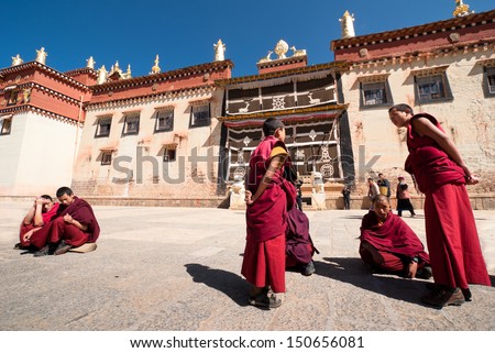 ZHONGDIAN,CHINA-APR 15: young monks debating in Songzanlin Tibetan Buddhist monastery area on April 15,2009 in Zhongdian,Yunnan China.Those who perform well have chance to become a higher lama.