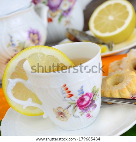 composition of breakfast with lemon tea and milk