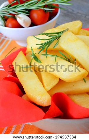 rustic big potatoes slice fried with rosemary aroma herbs