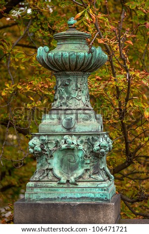 Old vintage vase with patina in prague park, Czech republic