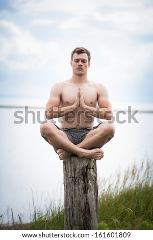 Image, Stock Photo Shirtless man doing yoga on terrace