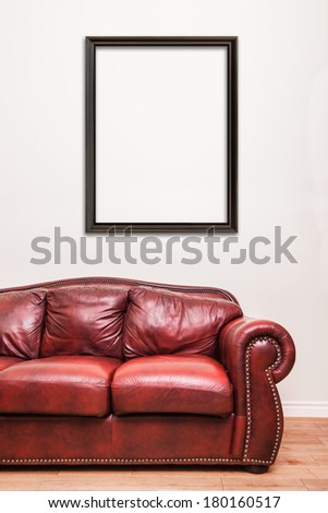 Luxurious Red Leather Couch in front of a blank frame to ad your text, logo, images, etc.