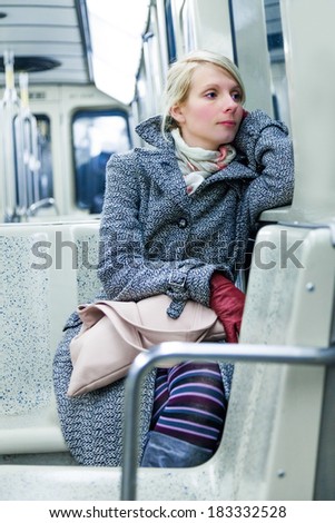 Young Woman Using Environmental Public Transportation to go Back Home After Work