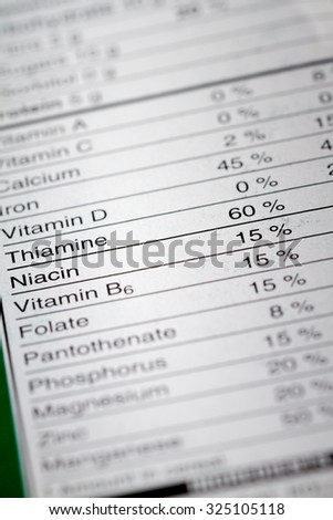 Shallow depth of Field image of Nutrition Facts Vitamins Percentages Information we can find on a grocery Store Product.