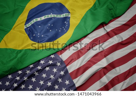 waving colorful flag of united states of america and national flag of brazil. macro Foto stock © 