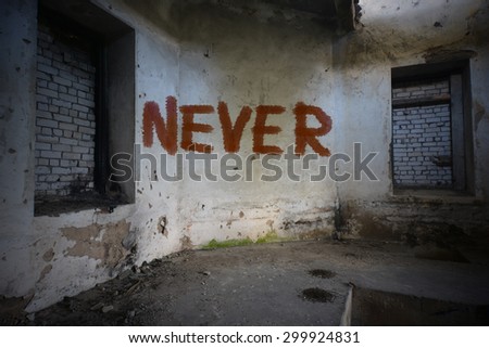 text never on the dirty old wall in an abandoned ruined house