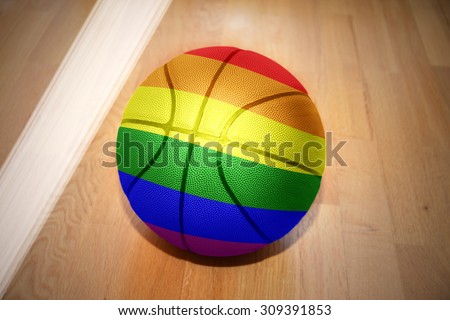basketball ball with gay flag  lying on the floor near the white line