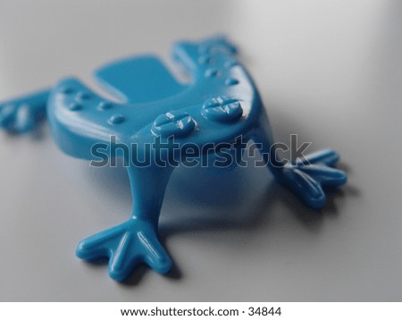 Traditional hopping frog toy.