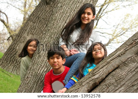 Four children in a tree, brother and sisters