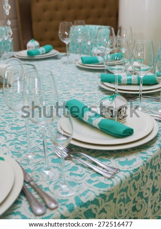 Festive dinnerware in turquoise and white lace