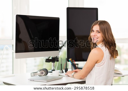 Stylish woman working at the computer in the office