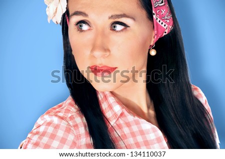 Retro, vintage portrait of a beautiful, brunette pin up girl.