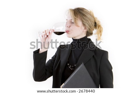 A business woman tasting wine