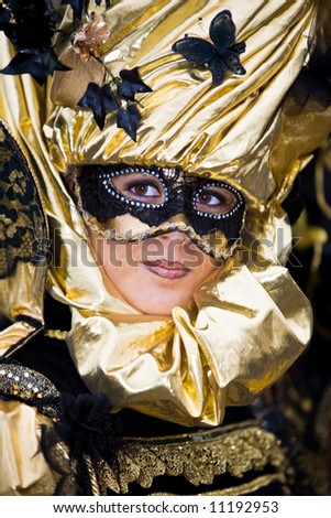 Gold and black costume at the Venice Carnival