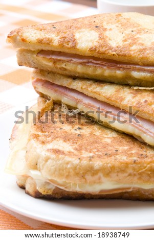 Toasted cheese and ham sandwiches fried in egg