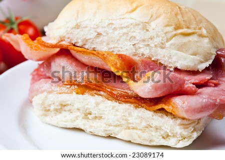 Delicious crispy bacon sandwich on a plate