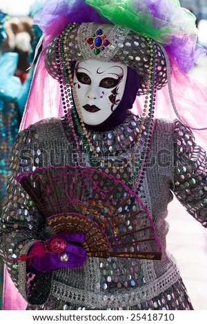 Silver costume with colourful sequins at the Venice Carnival