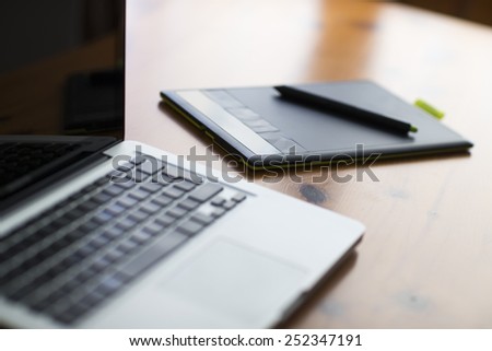 Laptop and graphic tablet on a table
