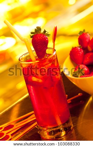 Ice strawberry tea with fresh strawberry at the background
