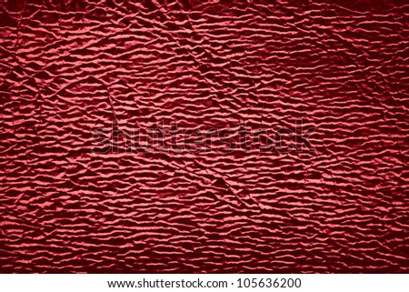 red leather background with white light reflexes