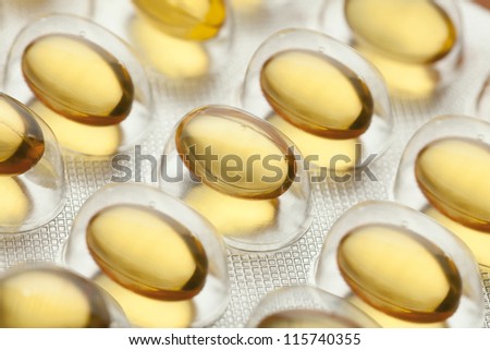 yellow tabs in blister pack, medical background