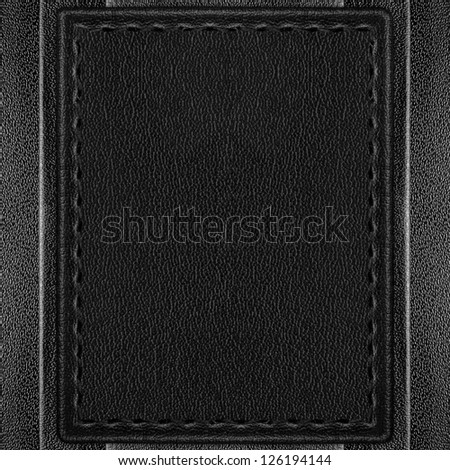 black leather background or grey leathery sheet on silver texture