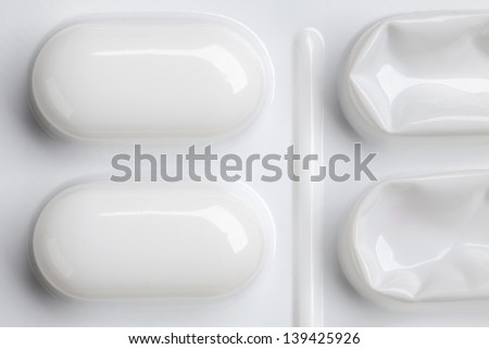 white blister pack of tablets or medical backdrop