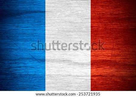 flag of France or French banner on wooden texture