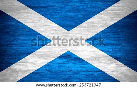 Scotland flag or Scottish banner on wooden texture