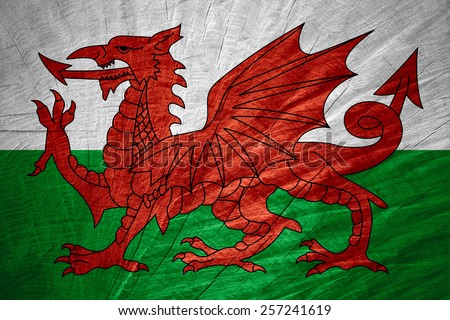 Wales flag or Welsh banner on wooden texture