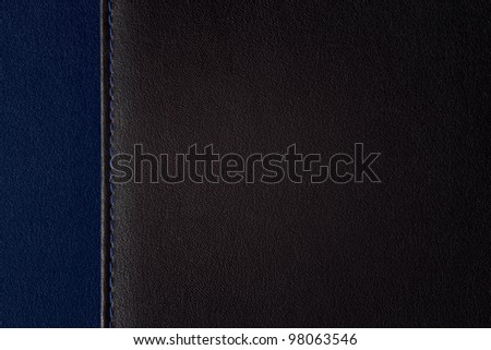 leather background segmented on two parts, black and blue