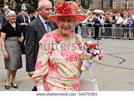 TORONTO-JULY 06: Thousands of people packed University Avenue and the grounds of Queen\'s Park to catch a glimpse of the Queen and the Duke of Edinburgh in Toronto, July 06, 2010