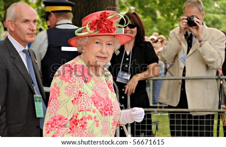 TORONTO-JULY 06: Thousands of people packed University Avenue and the grounds of Queen\'s Park to catch a glimpse of the Queen and the Duke of Edinburgh in Toronto, July 06, 2010