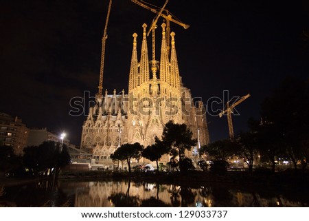 BARCELONA, SPAIN - FEBRUARY 9: The Basilica of La Sagrada Familia at night. Designed by Antoni Gaudi, its construction began in 1882 and is not finished yet on February 9, 2013 in Barcelona, Spain.