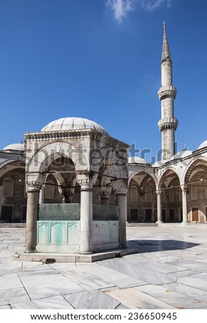 ISTANBUL, TURKEY - AUGUST 21: Ablution fountain and minaret of the Blue Mosque on August 21, 2014 in Istanbul, Turkey. Blue Mosque was built from 1609 to 1616 by architect Sedefkar Mehmed Aga.