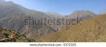 Very high mountains with snowed peaks not far from the sahara desert - Setti Fadma Atlas - Ourika valley - Morocco - Panorama.