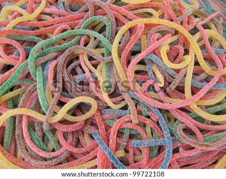 stock-photo-gummy-spaghetti-candies-jelly-beans-and-wine-gums-99722108.jpg